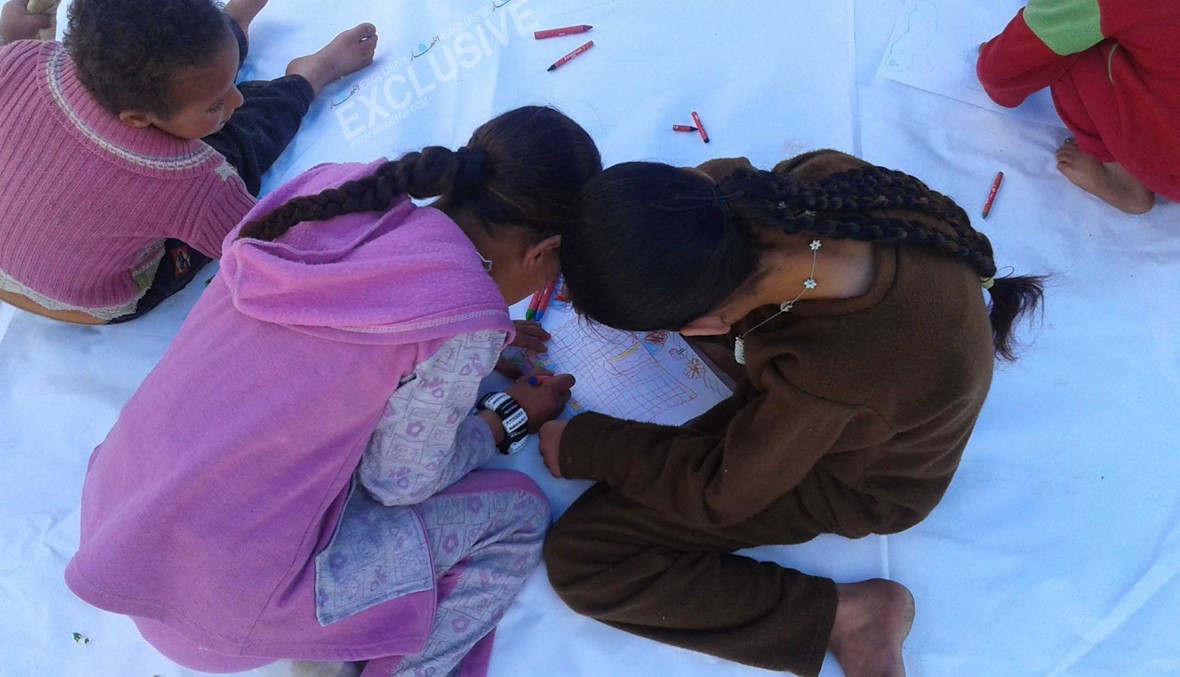 بالصور: أولاد سوريون يرسمون "بيت الأحلام" على الورق