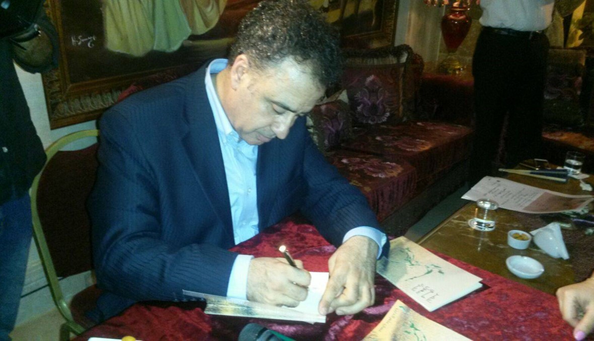 توقيع متناغم لكتاب غسان علم الدين "أخضر في سهول الجراد"