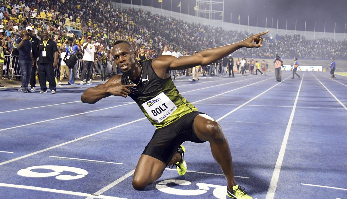 بالصور: بولت "المتوتر" يفوز بسباق 100 متر الأخير في جامايكا