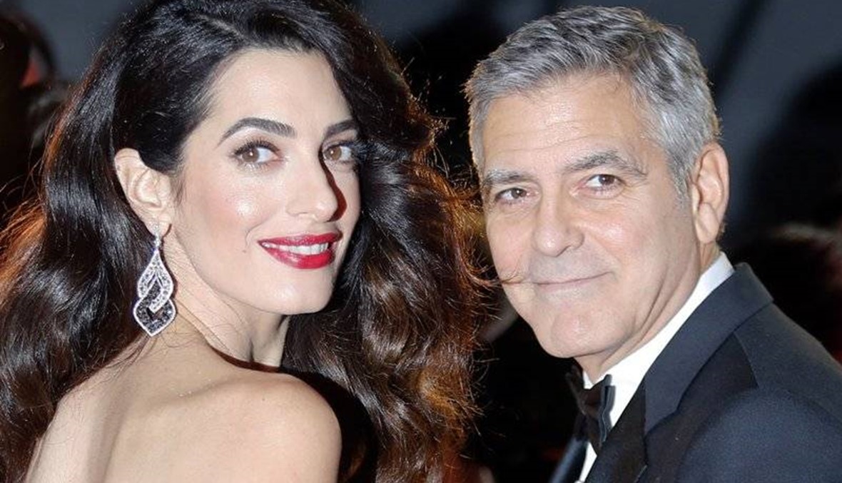 George Clooney threatens prosecution over pics of baby twins