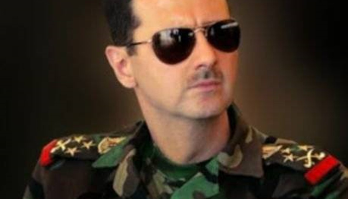 الأسد يوسّع قاعدة شعبيته الى أميركا...صوره في تظاهرة النازيين الجدد!