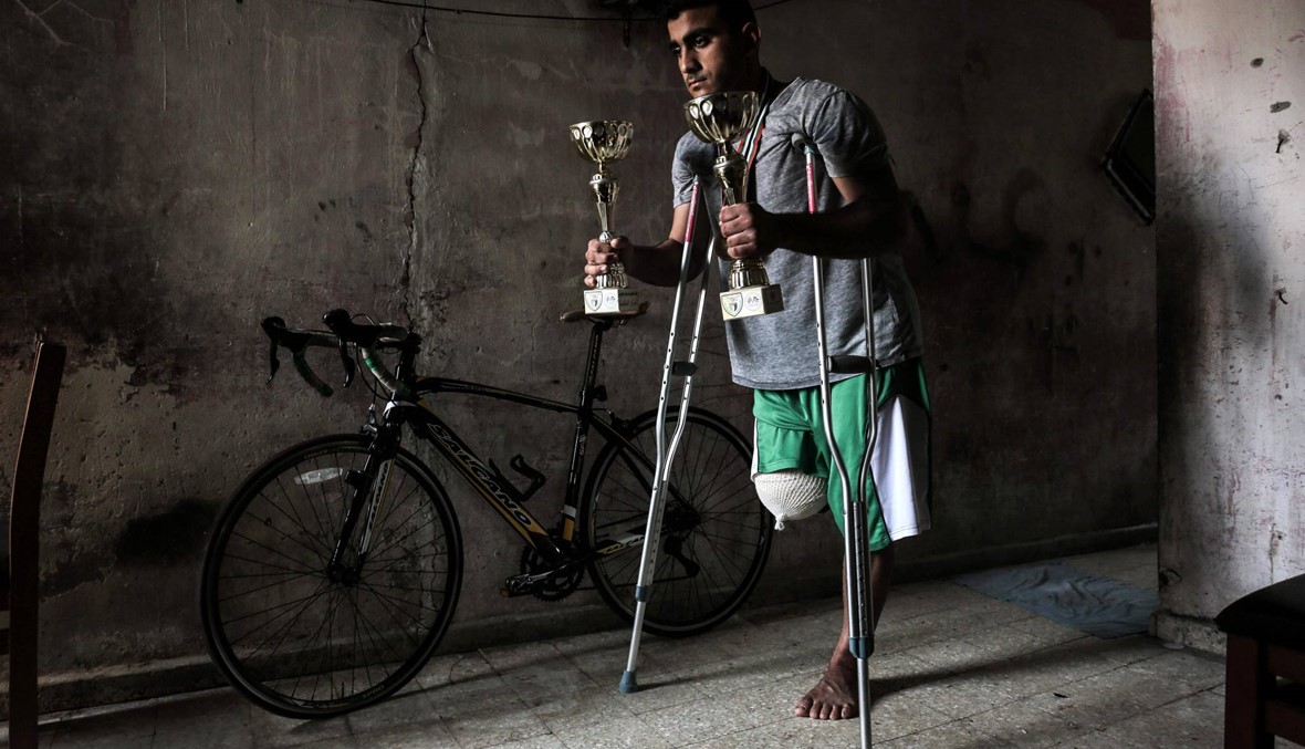 رصاصة إسرائيلية تحرم دراجا فلسطينيا من أولمبياد آسيا (أ ف ب).