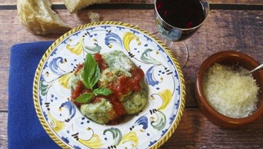 Tuscan Spinach and Ricotta Dumplings topped with marinara