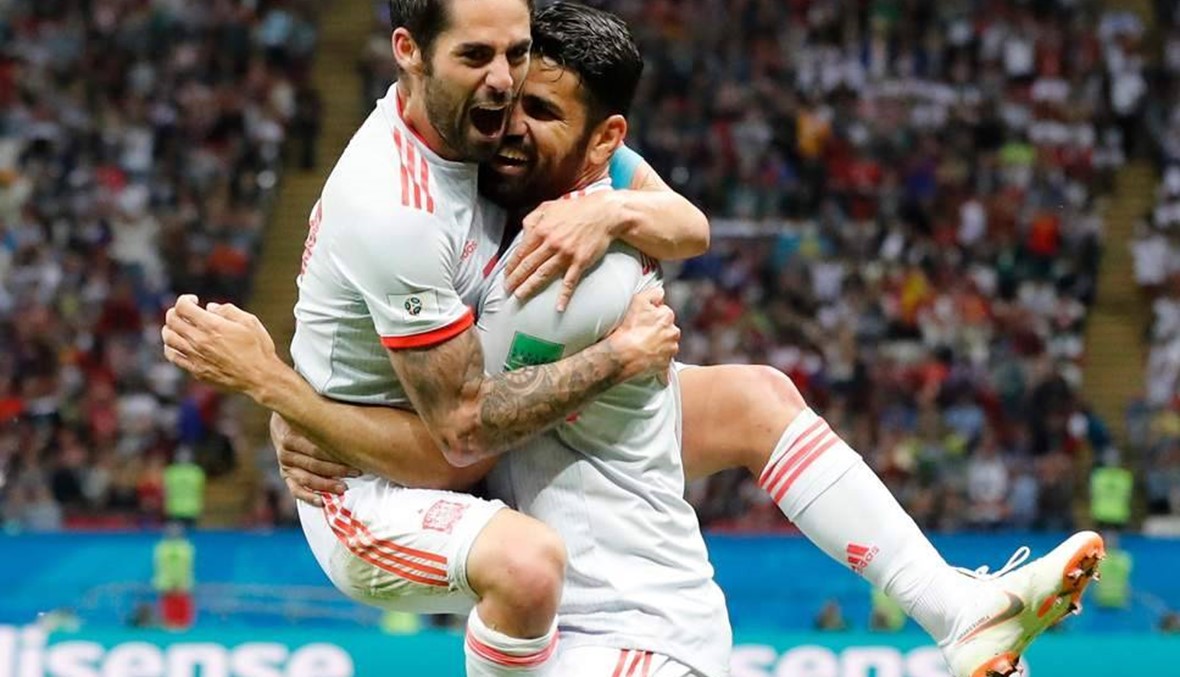 Spain survive "heart attack" game against feisty Iran