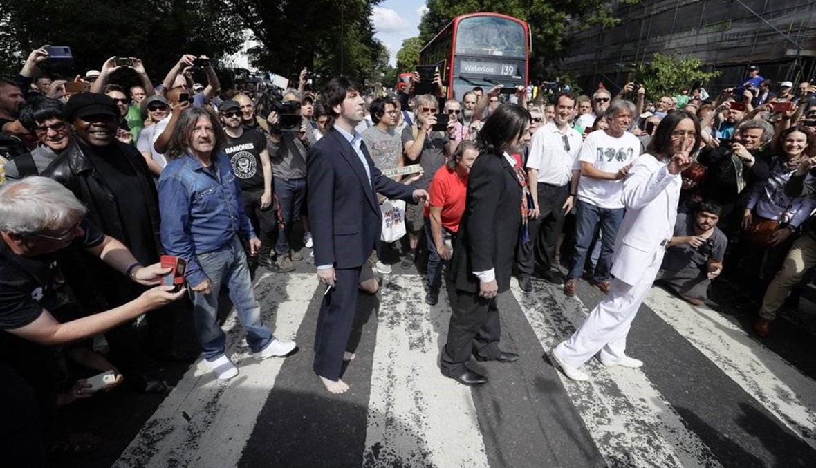 Fans recreate Beatles’ Abbey Road cover shot 50 years on