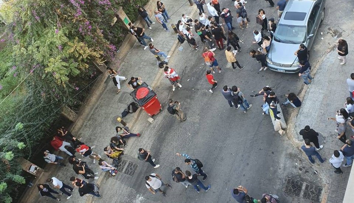 Students protest against the university’s decision to resume classes