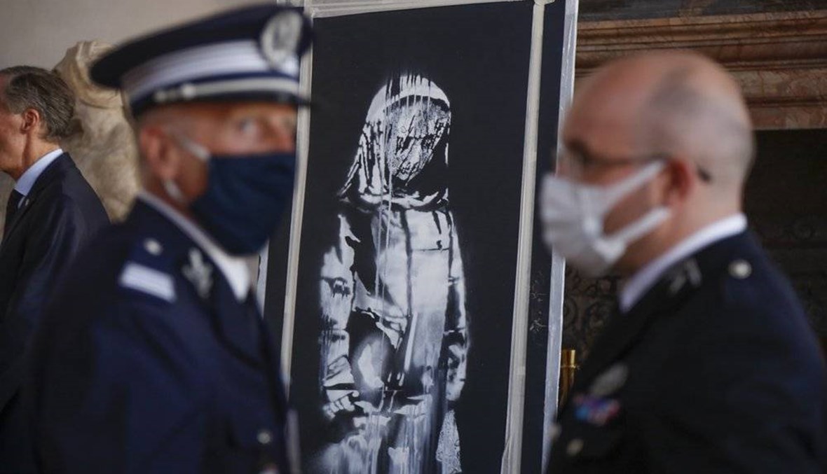 Italy returns stolen Banksy to France on Bastille Day