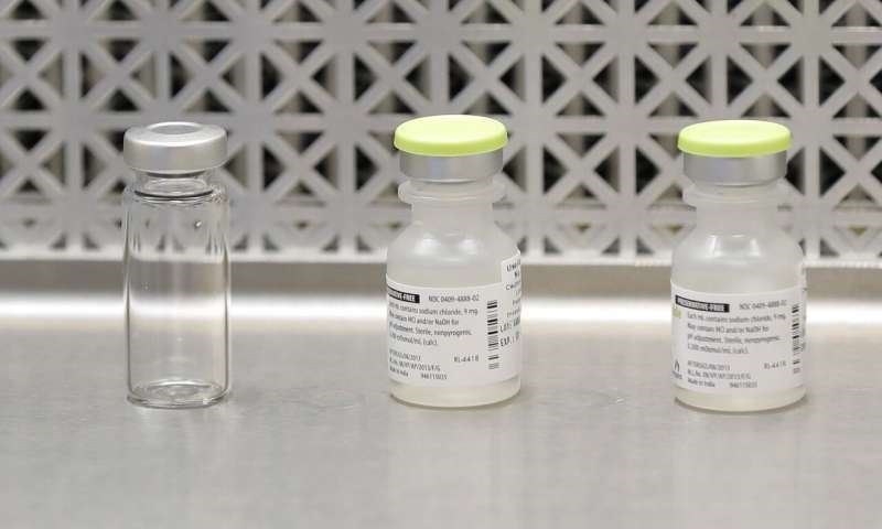This March 16, 2020 file photo shows vials used by pharmacists to prepare syringes used on the first day of a first-stage safety study clinical trial of the potential vaccine for COVID-19, the disease caused by the new coronavirus, in Seattle. (AP Photo)