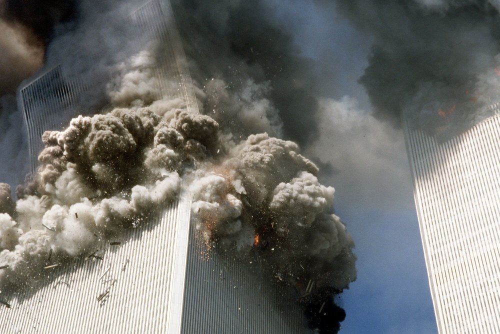 In this Sept. 11, 2001, file photo, the south tower of the World Trade Center, left, begins to collapse after a terrorist attack on the landmark buildings in New York. (AP Photo)