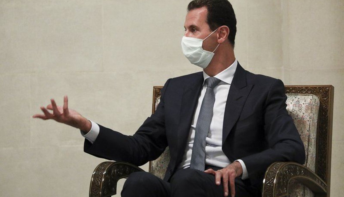 Syrian President Bashar al-Assad gestures while speaking to Russian Foreign Minister Sergey Lavrov during their talks in Damascus, Syria. (Russian Foreign Ministry Press Service via AP)