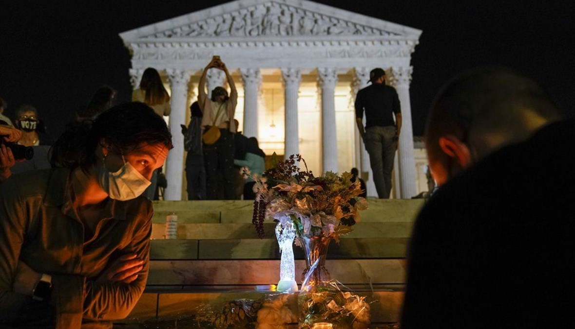 People gather at the Supreme Court Friday, Sept. 18, 2020, in Washington, after the Supreme Court announced that Supreme Court Justice Ruth Bader Ginsburg died of metastatic pancreatic cancer at age 87. (AP Photo)