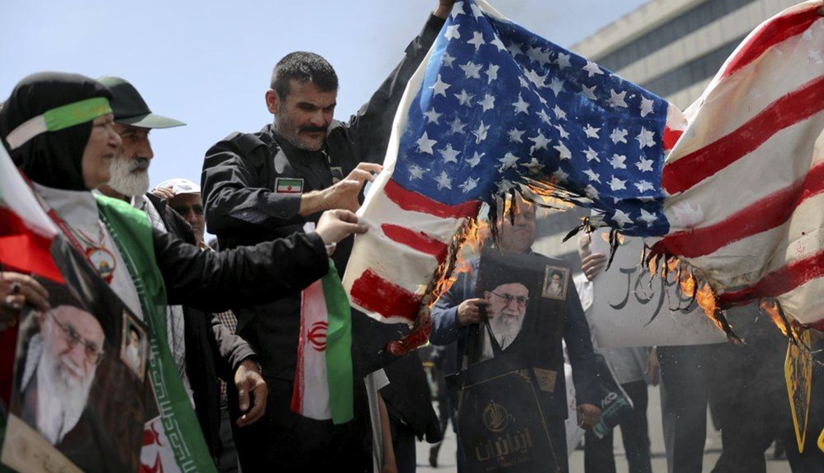 Iranian worshippers burn a representation of a U.S. flag during a rally after Friday prayer in Tehran, Iran, Friday, May 10, 2019. (AP Photo)