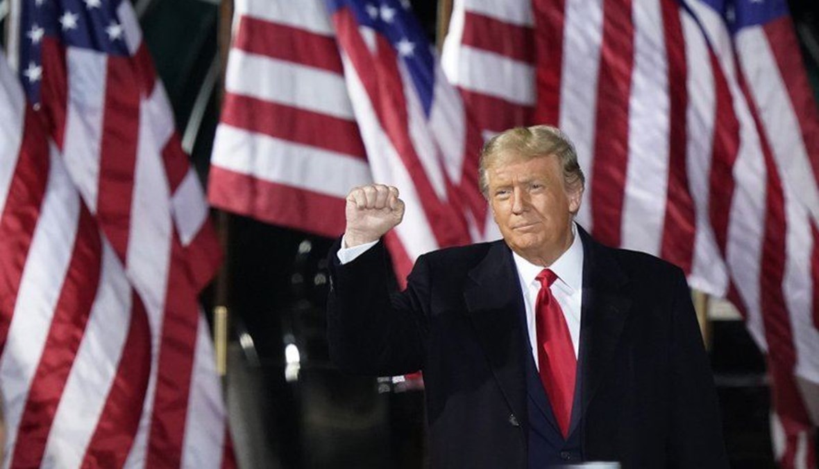 President Donald Trump pumps his fist before speaking at a campaign rally, Monday, Sept. 21, 2020, in Swanton, Ohio. (AP Photo)