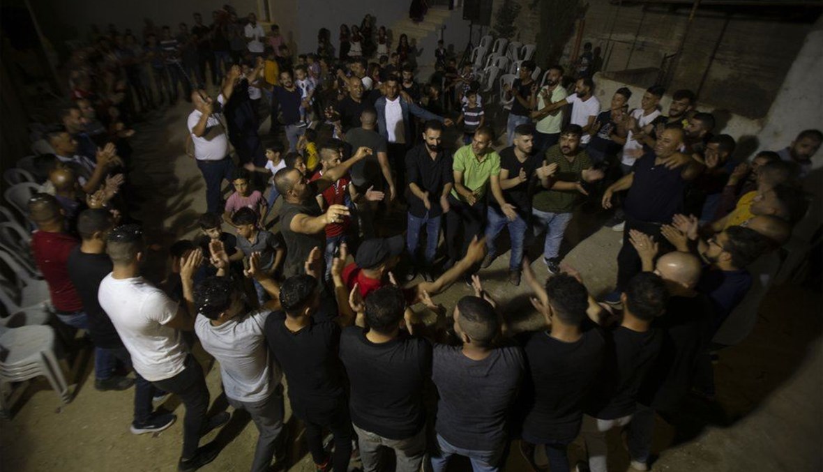 Palestinians celebrate during a wedding party in Azmut near the West Bank city of Nablus, Thursday, Sept. 24, 2020. (AP Photo)