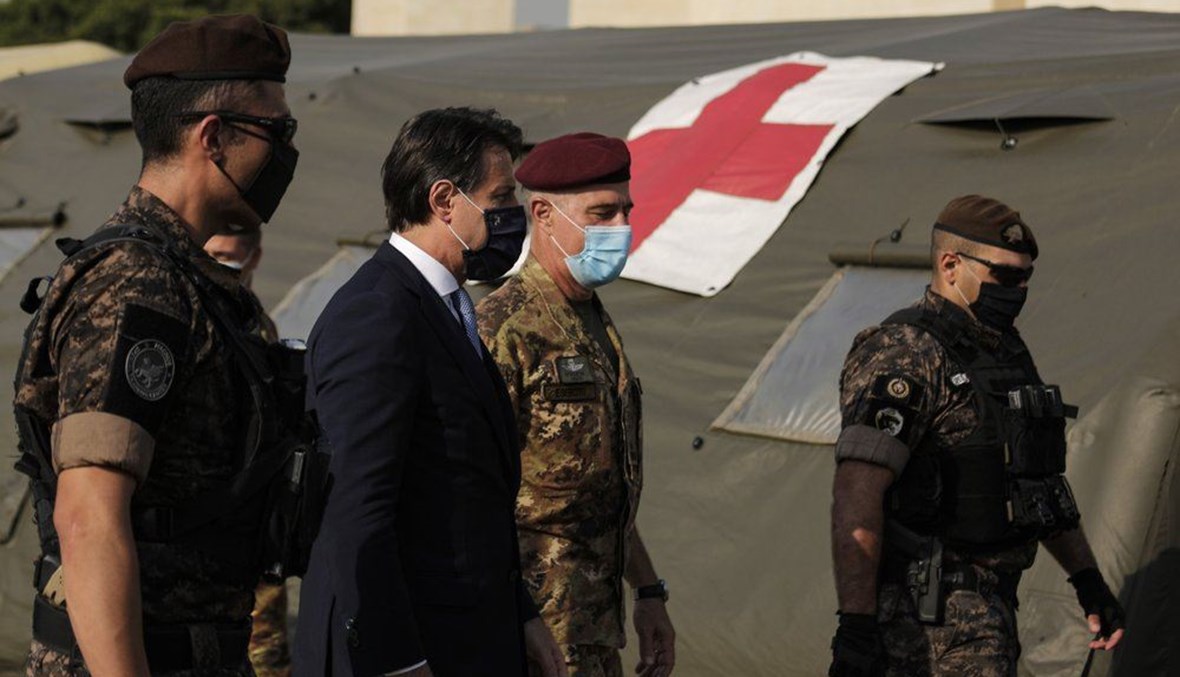 Italian Prime Minister Giuseppe Conte, second left, visits an Italian field hospital set up at the Lebanese University in the Hadath district of Beirut, Lebanon, Tuesday, Sept. 8, 2020. (AP Photo)