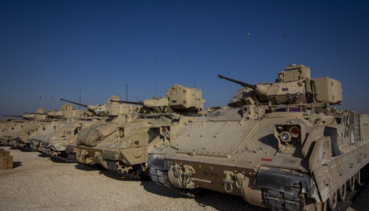 Bradley fighting vehicles are parked at a U.S. military base at an undisclosed location in Northeastern Syria, Monday, Nov. 11, 2019. (AP Photo)