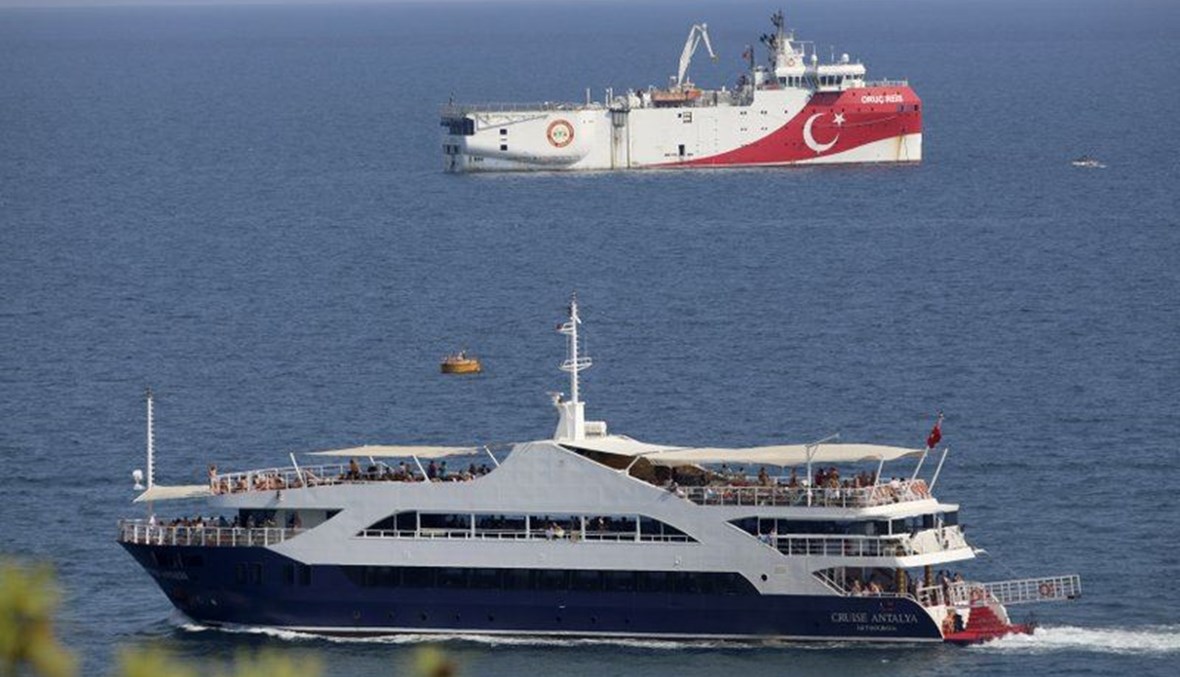 Turkey's research vessel, Oruc Reis, rear, anchored off the coast of Antalya on the Mediterranean, Turkey, Sunday, Sept. 13, 2020. (AP Photo)