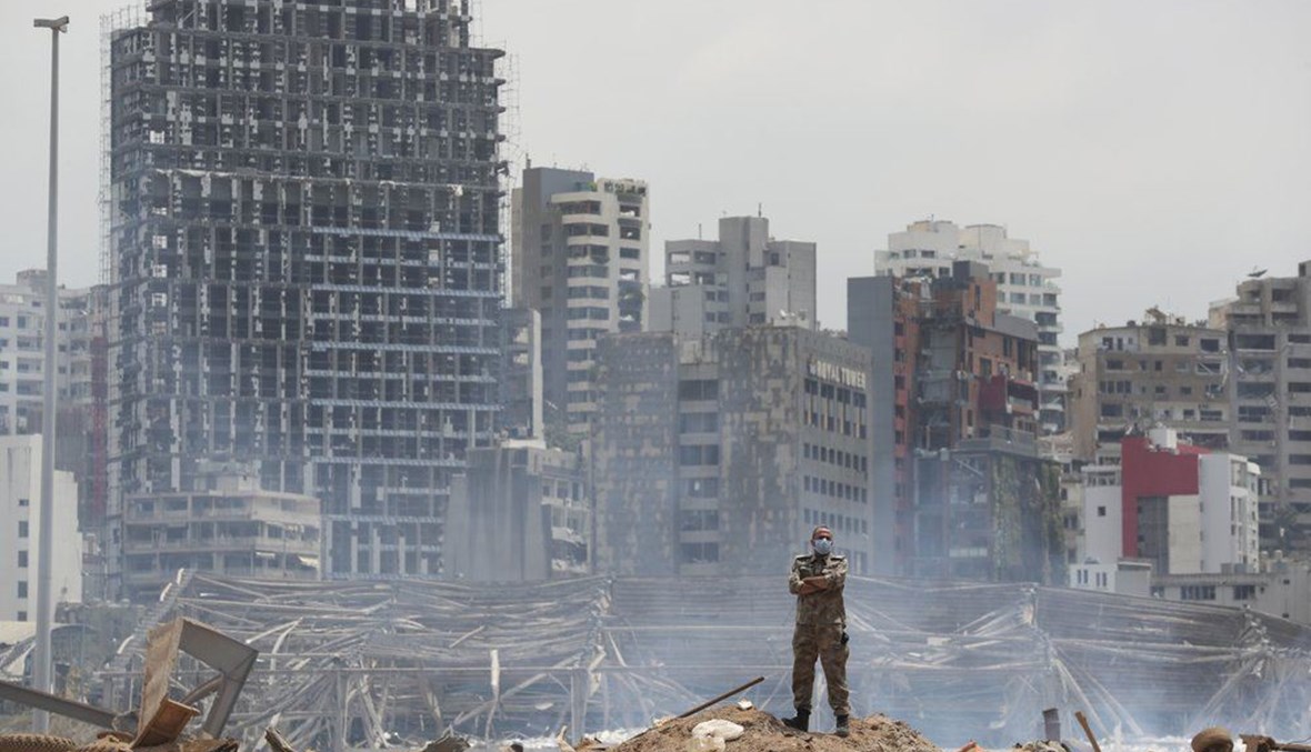 In this Aug. 6, 2020, file photo, a soldier stands at the devastated site of the explosion in the port of Beirut, Lebanon. (AP Photo)