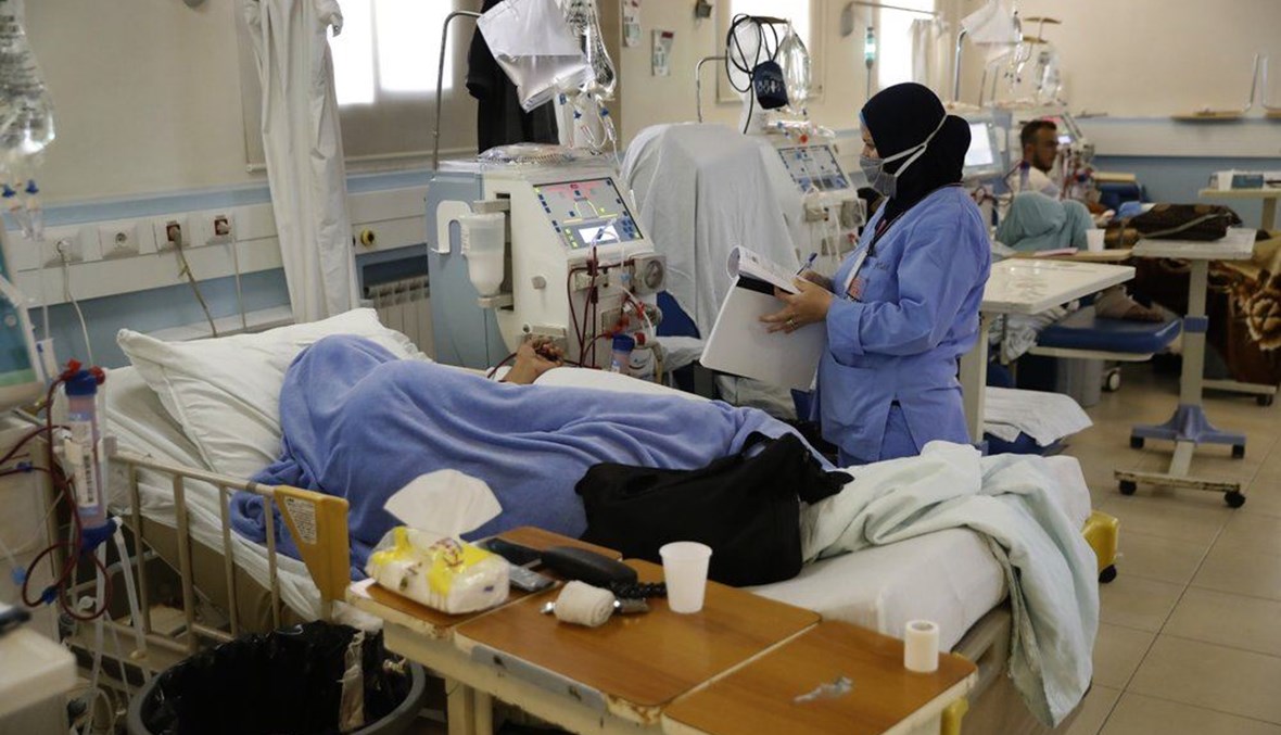 A nurse checks a dialysis patient at a governmental hospital, in Tripoli, Lebanon, Thursday, July 16, 2020. (AP Photo)