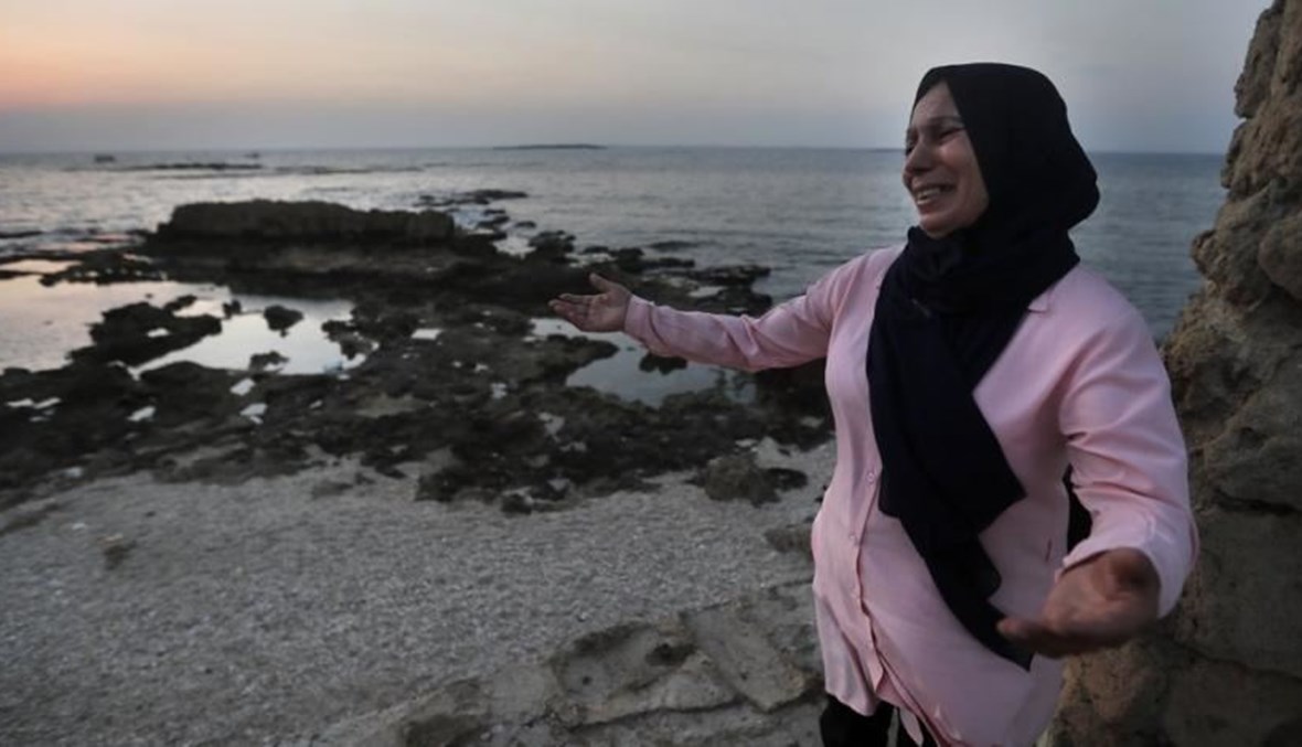 Lebanese Afaf Adulhamid the mother of Mohammed Khaldoun, who is still missing at sea while he was trying with other migrants to reach Cyprus on a boat, cries and prays her son's safe return. (AP Photo)