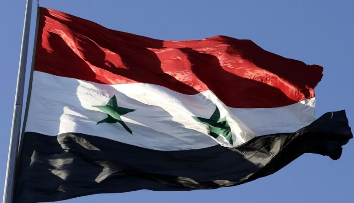 العلم السوري (تعبيرية- أ ف ب).