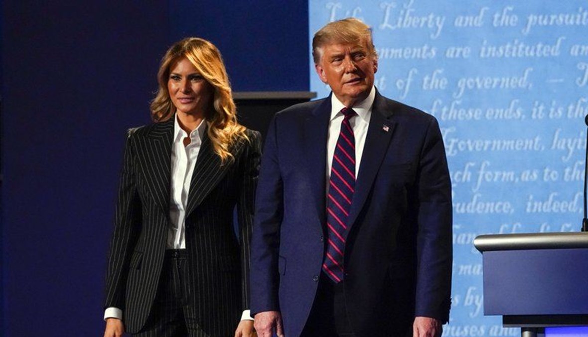 President Donald Trump stands on stage with first lady Melania Trump after the first presidential debate with Democratic presidential candidate former Vice President Joe Biden Tuesday, Sept. 29, 2020, at Case Western University and Cleveland Clinic, in Cleveland, Ohio. (AP Photo)