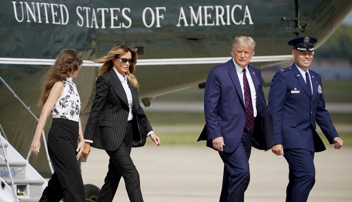 President Donald Trump and first lady Melania Trump walk to board Air Force One to travel to the first presidential debate in Cleveland, Tuesday, Sept. 29, 2020, in Andrews Air Force Base, Md. (AP Photo)