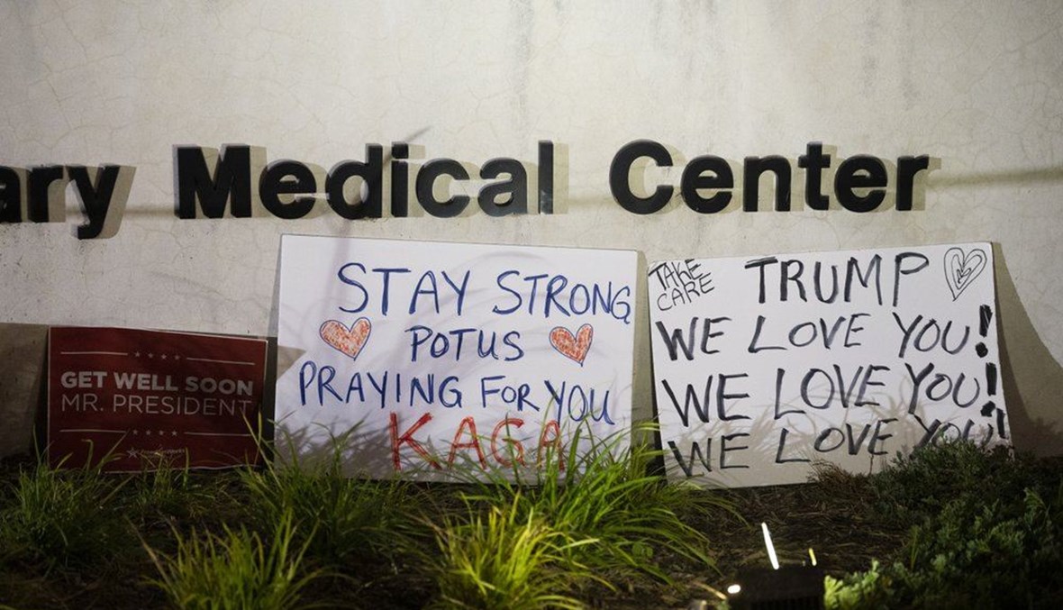Signs left by supporters of President Donald Trump at the entrance to Walter Reed National Military Medical Center in Bethesda, Md., Sunday, Oct. 4, 2020. (AP Photo)