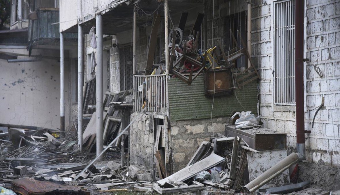 Damage in a residential area after shelling by Azerbaijan's artillery during a military conflict in self-proclaimed Republic of Nagorno-Karabakh, Stepanakert, Azerbaijan, Sunday, Oct. 4, 2020. (AP Photo)