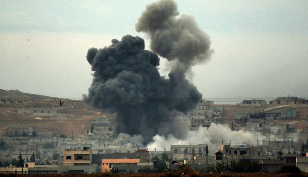 Thick smoke rises following an airstrike by the US-led coalition in Kobani, Syria while fighting continued between Syrian Kurds and the Islamic State group. (AP Photo)
