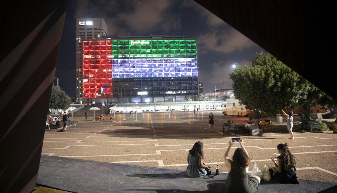 In this Thursday, Aug. 13, 2020, the Tel Aviv City Hall is lit up with the flag of the United Arab Emirates as Israel and the UAE announced they would be establishing full diplomatic ties, in Tel Aviv, Israel. (AP Photo)