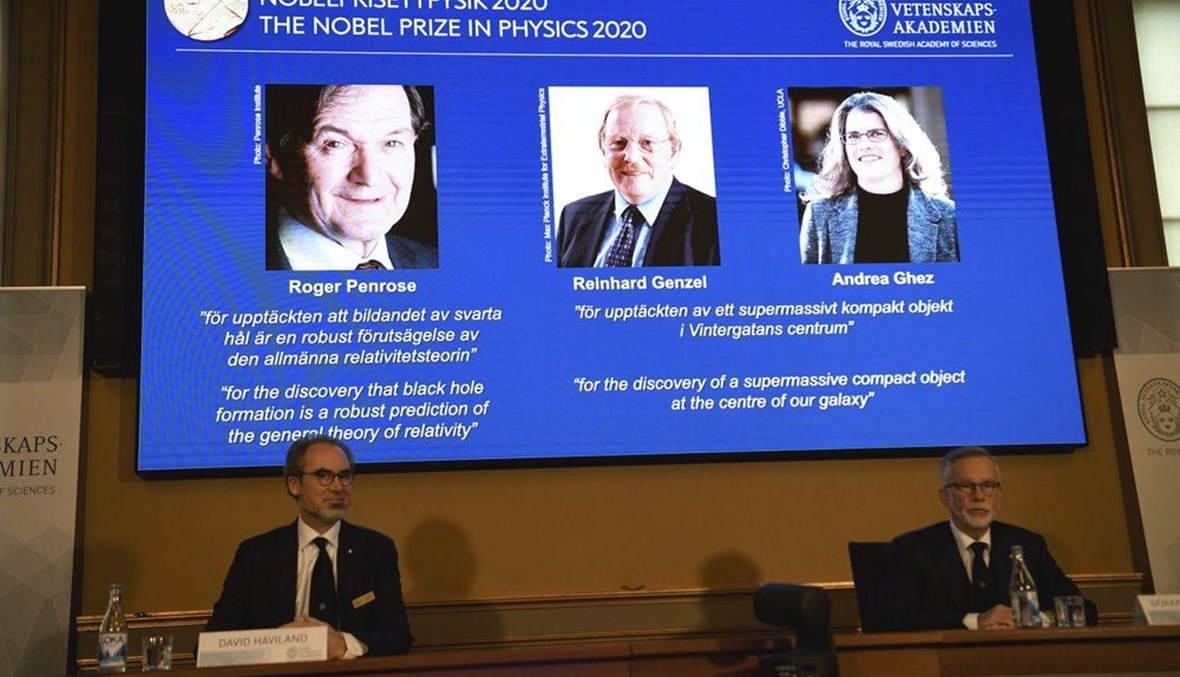 David Haviland, member of the Nobel Committee for Physics, left, and Goran K. Hansson, Secretary General of the Academy of Sciences, announce the winners of the 2020 Nobel Prize in Physics during a news conference at the Royal Swedish Academy of Sciences, in Stockholm, Sweden, Tuesday Oct. 6, 2020. (AP Photo)