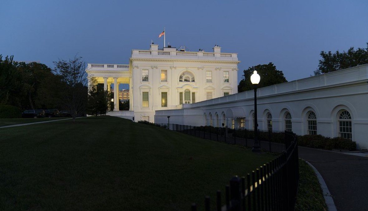 The White House is illuminated at sunset, Tuesday, Oct. 6, 2020, in Washington. (AP Photo)