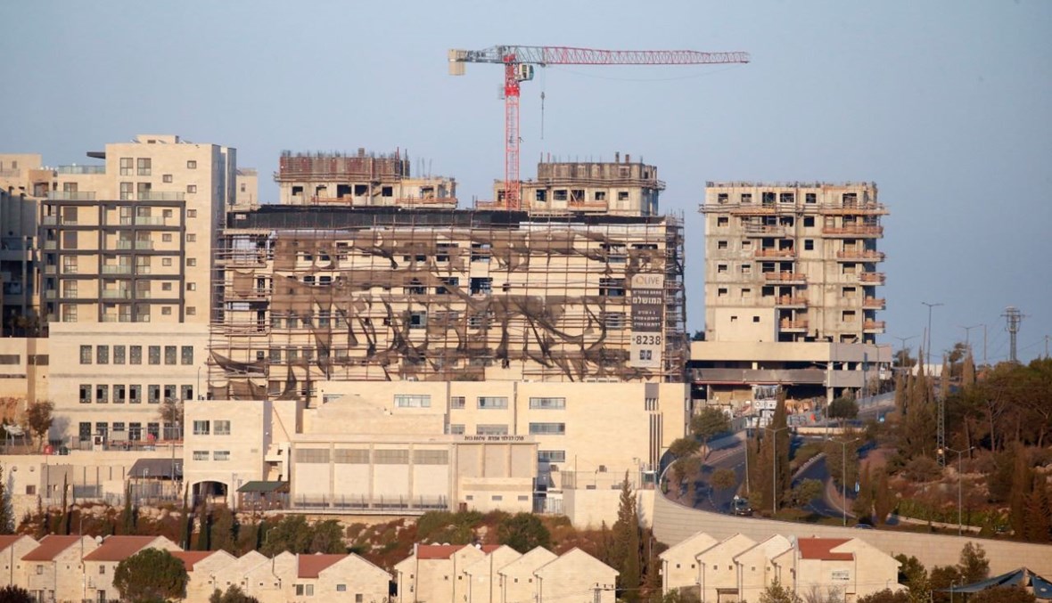 مبان جديدة في مستوطنة إفرات الإسرائيلية جنوب مدينة بيت لحم بالضفة الغربية المحتلة  (14 ت1 2020، أ ف ب). 