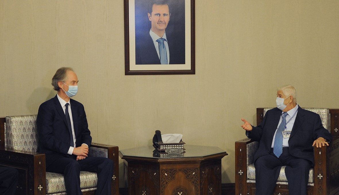 وزير الخارجية السوري وليد المعلم يلتقي موفد الأمم المتحدة غير بيدرسن (أ ف ب).
