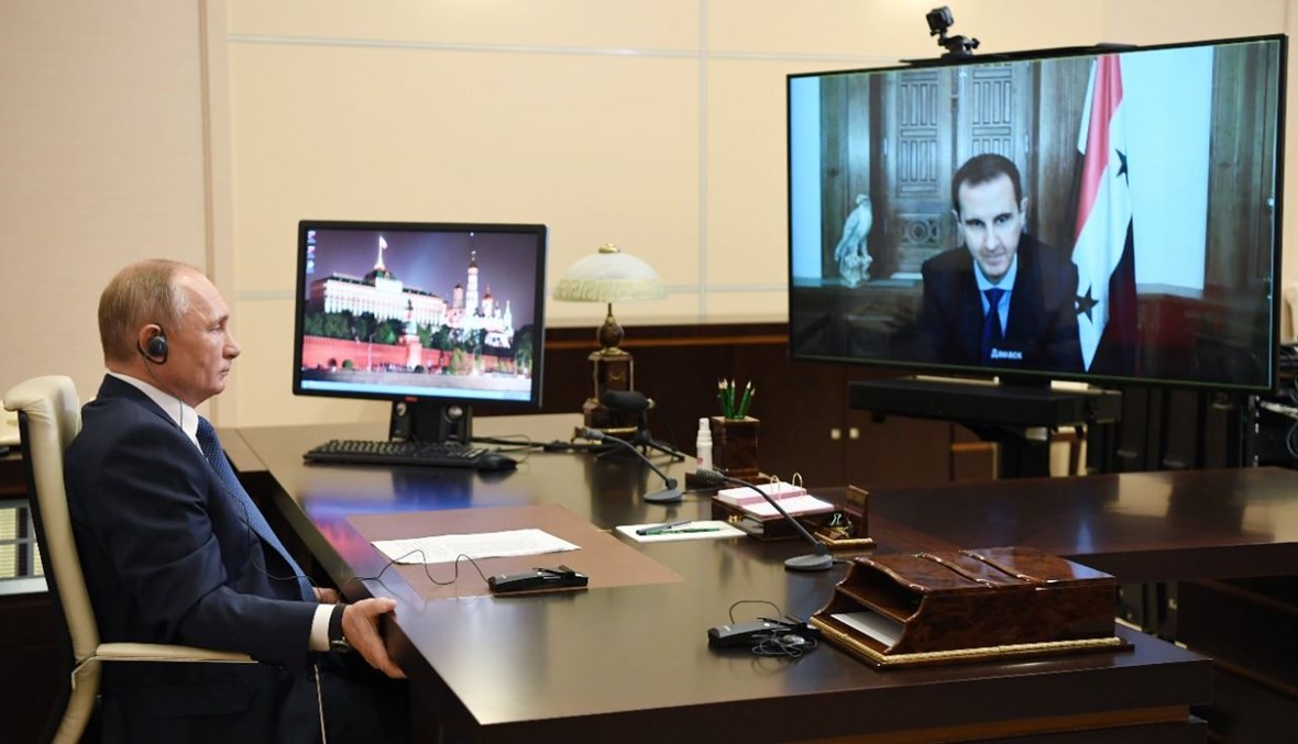 بوتين والاسد خلال المكالمة بينهما عبر الفيديو (9 ت2 2020، أ ف ب). 