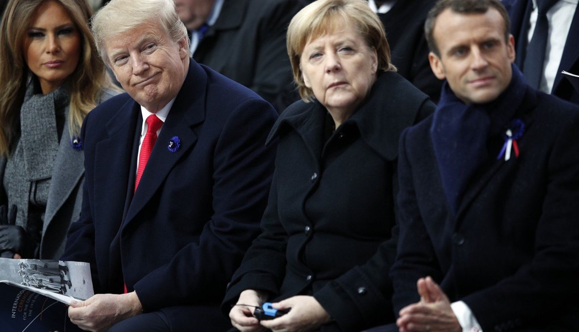 الرئيس الأميركي دونالد ترامب والمستشارة الألمانية أنجيلا ميركل والرئيس الفرنسي إيمانويل ماكرون، 2018 - "أ ب"
