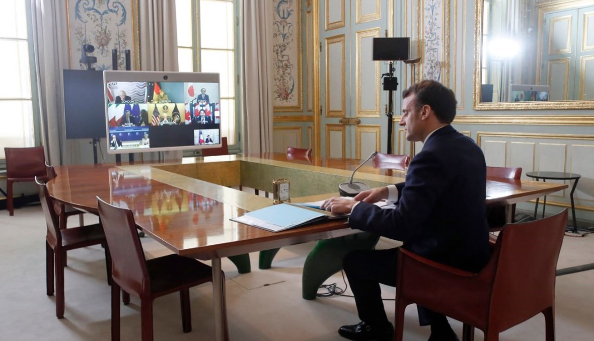 ماكرون مشاركا في قمة مجموعة السبع عبر الإنترنت، من قصر الاليزيه في باريس (19 شباط 2021، أ ف ب).