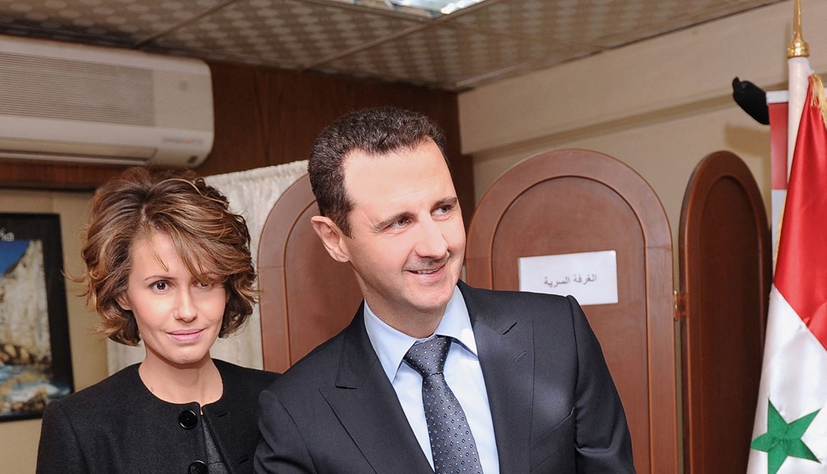 الرئيس السوري بشار الأسد وزوجته أسماء (أ ف ب).