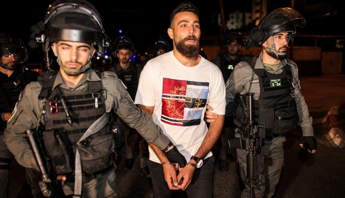 اعتقالات بعد مواجهات بين الشرطة الإسرائيلية وشبان فلسطينين  (أ ف ب).