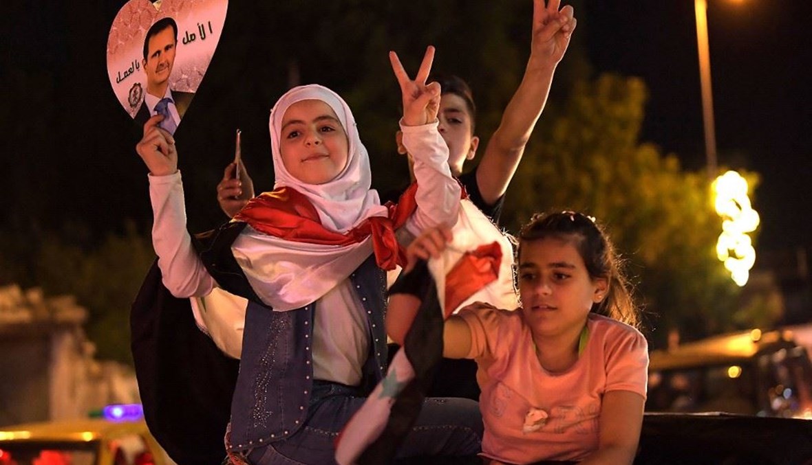 احتفالات بانتخاب الأسد في سوريا (أ ف ب).