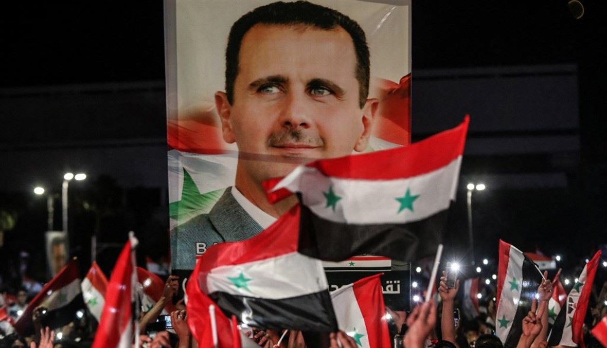 احتفالات بفوز الأسد في سوريا (أ ف ب).