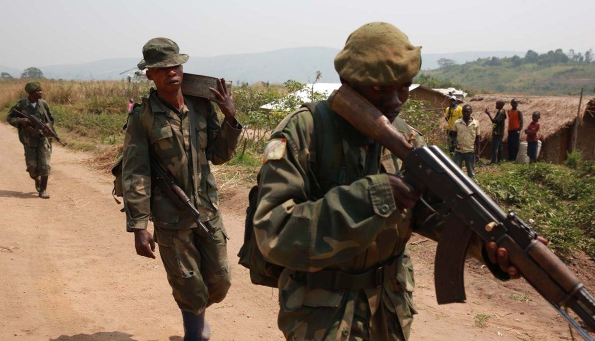 جنود مع القوات المسلحة لجمهورية الكونغو الديموقراطية في دورية خلال نزاع إيتوري في عام 2015 (الصورة MONUSCO/ ويكيميديا كومنز). 
