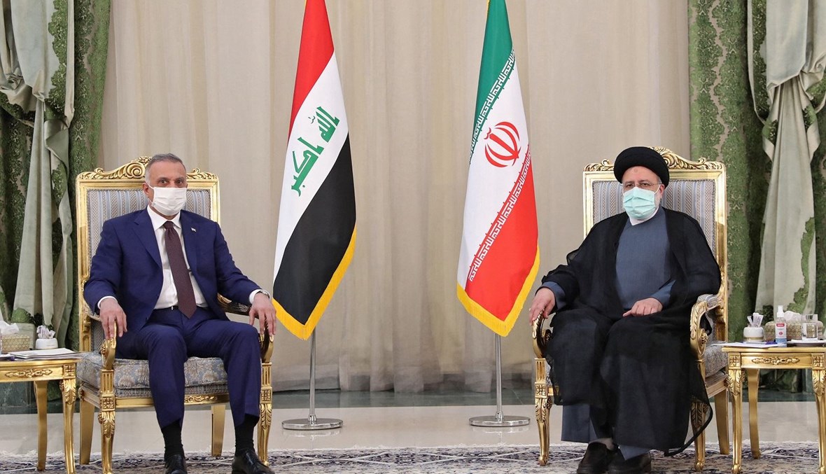 رئيس الوزراء العراقي مصطفى الكاظمي والرئيس إبراهيم رئيسي (أ ف ب).