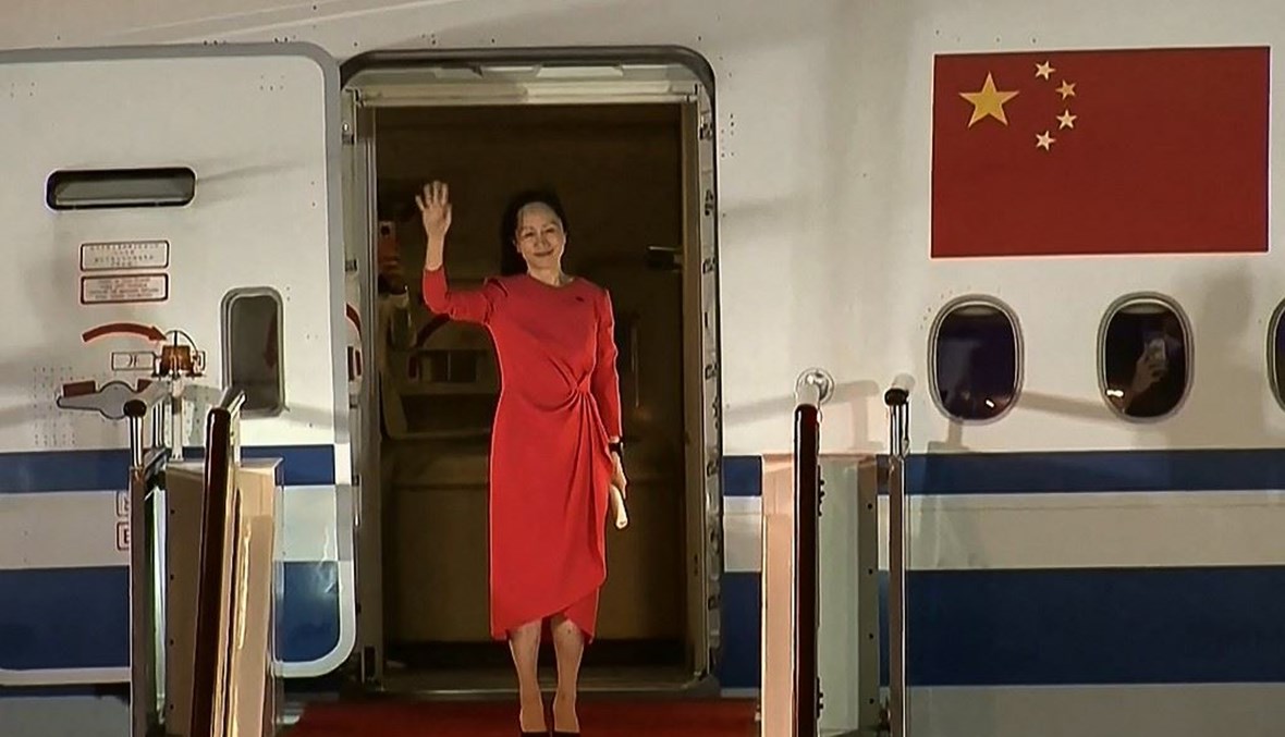 مديرة "هواوي" عند وصولها الصين (أ ف ب).