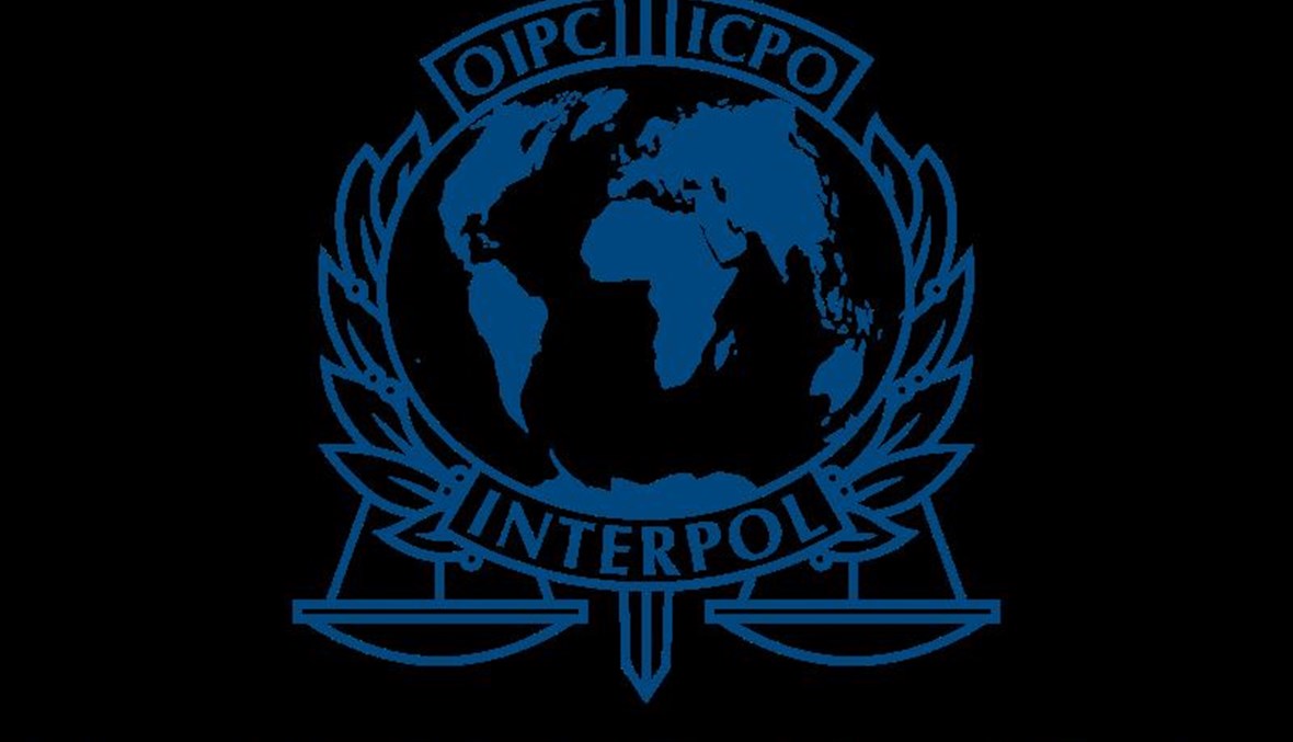 شعار الانتربول (ويكيبيديا). 