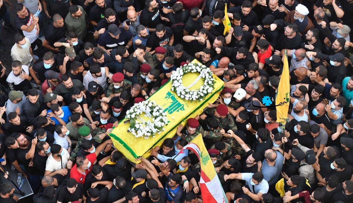 "حزب الله" مشيّعاً ضحايا اشتباكات الطيونة (نبيل اسماعيل).