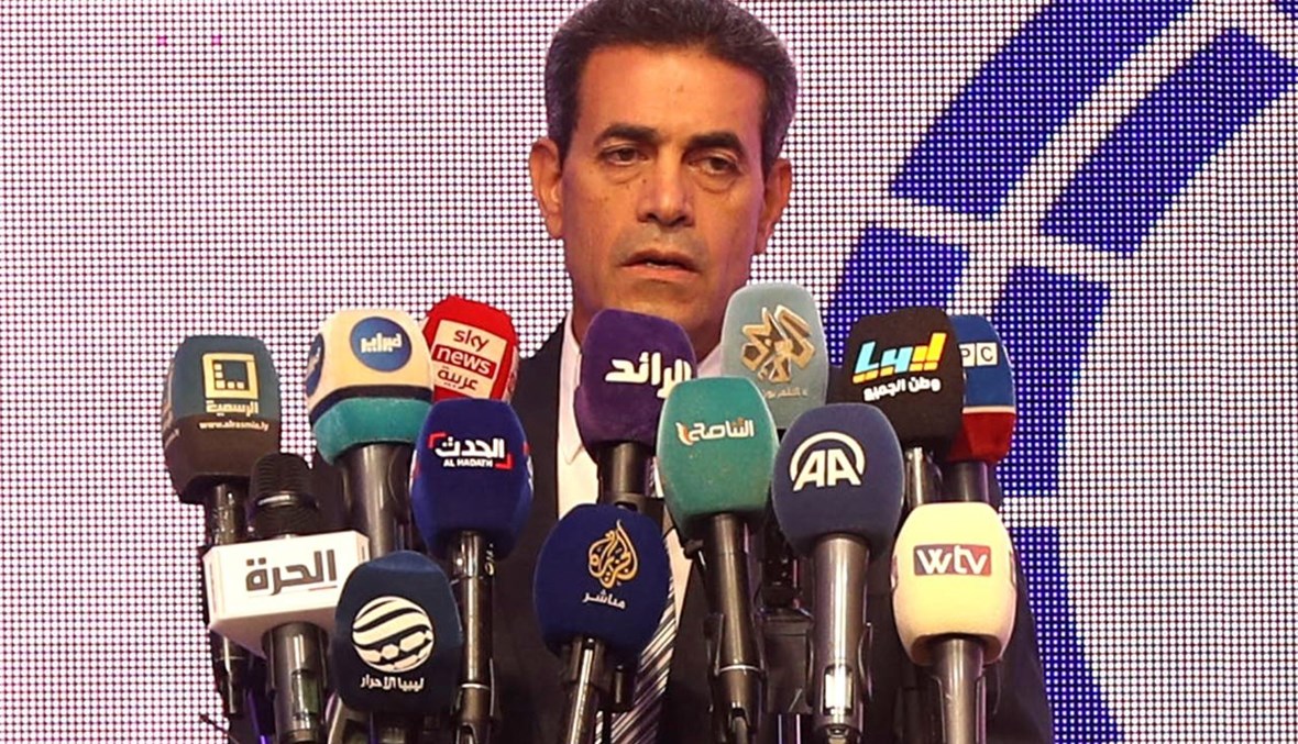 رئيس المفوضية الوطنية العليا للانتخابات في ليبيا عماد السايح  يعقد مؤتمرا صحافيا في طرابلس (24 ت1 2021، أ ف ب). 