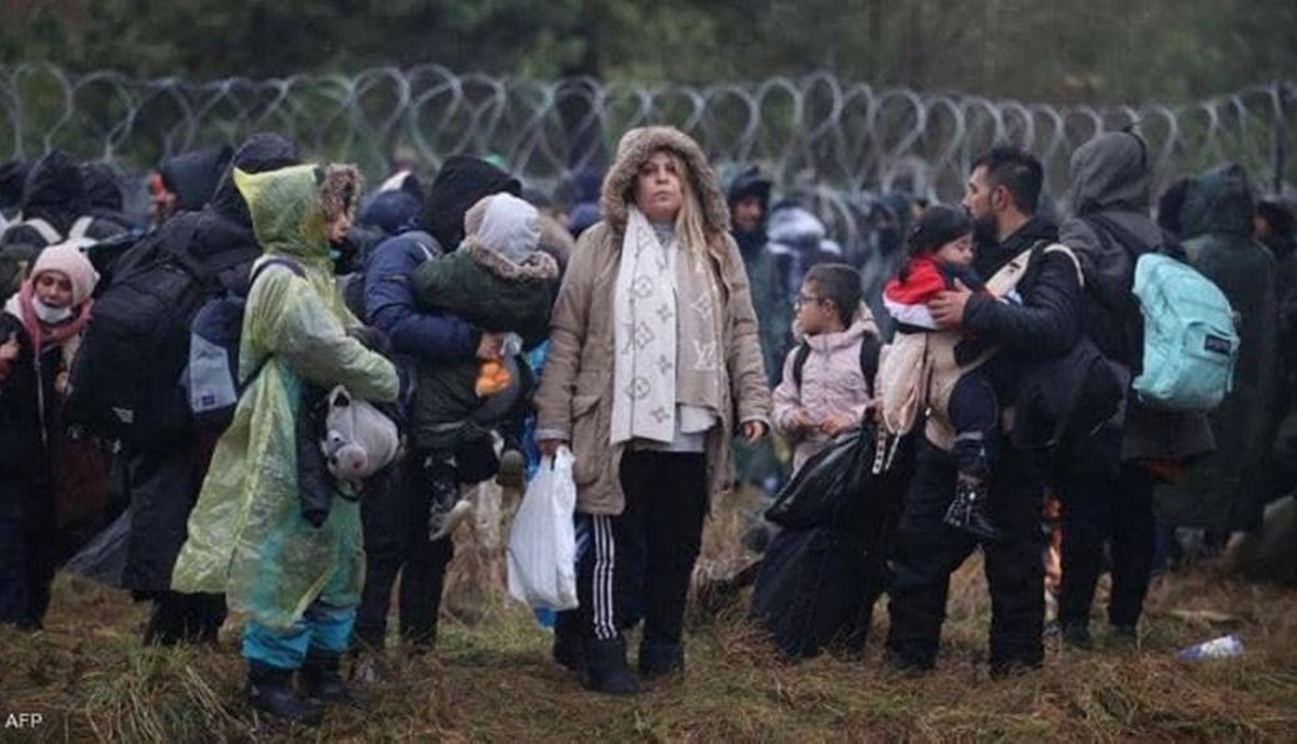 مهاجرون على الحدود مع بيلاروسيا (أ ف ب).