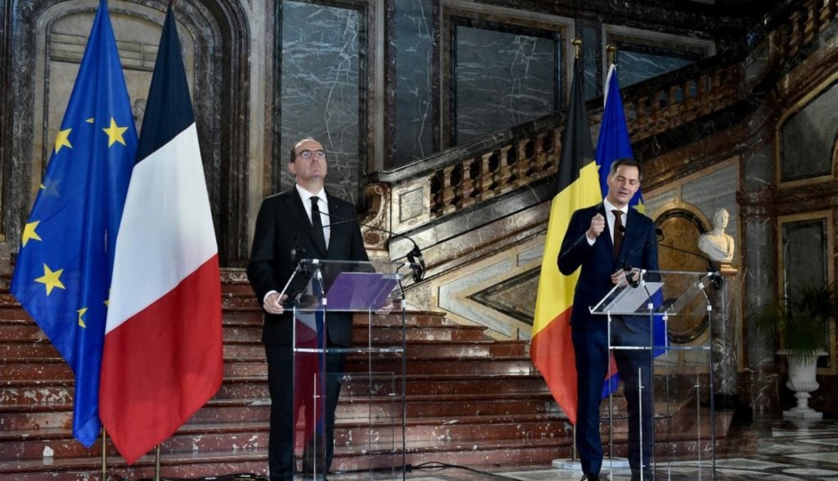 رئيس الوزراء الفرنسي ونظيره البلجيكي في مؤتمر صحافي مشترك في بلجيكا (أ ف ب).